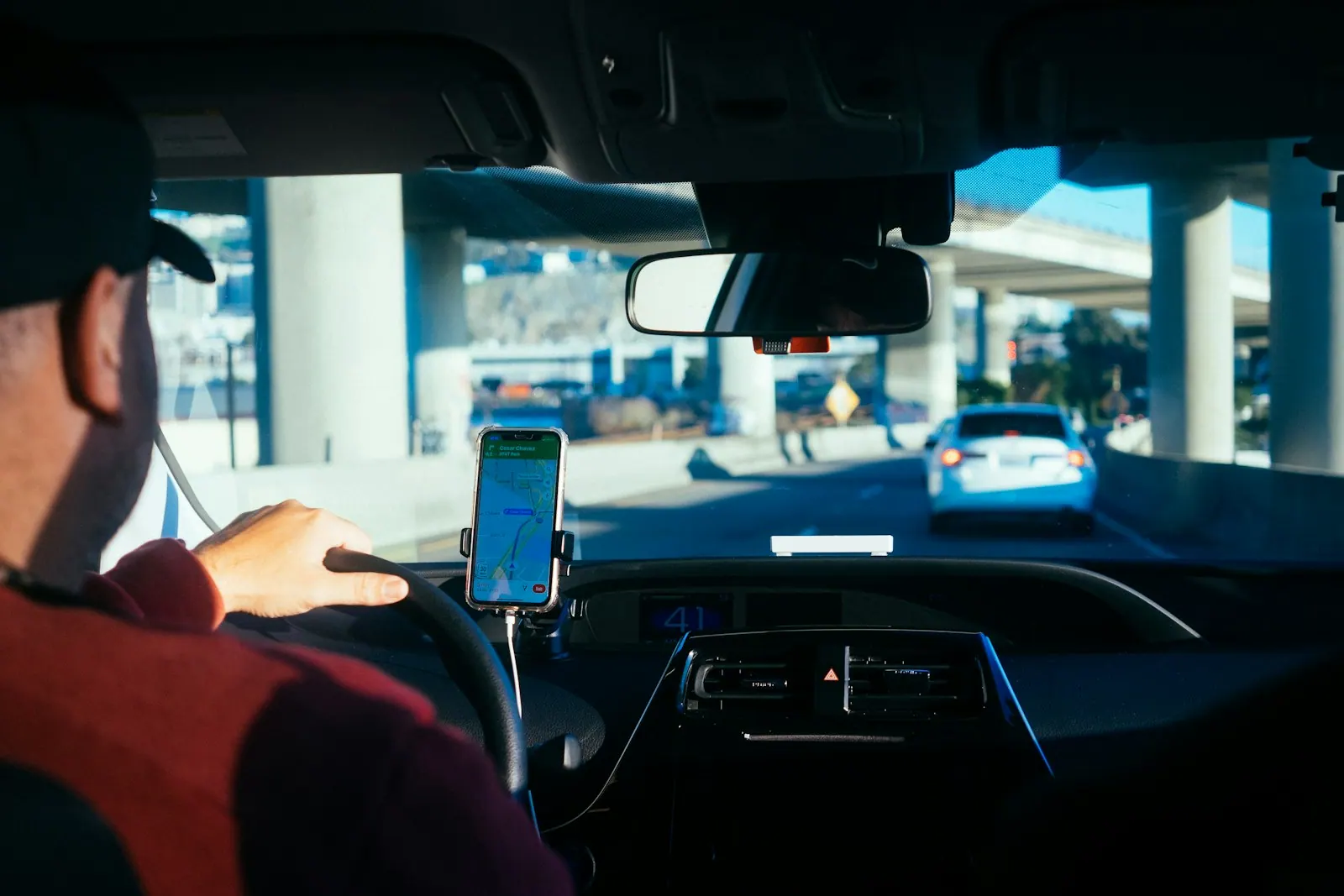 Professional driver at the wheel in city traffic